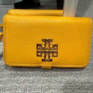 Tory Burch yellow wristlet wallet, beautiful gold accent.